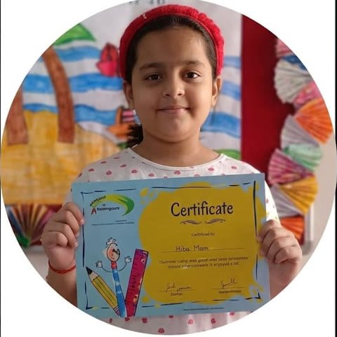 Aananditaa holding her certificate